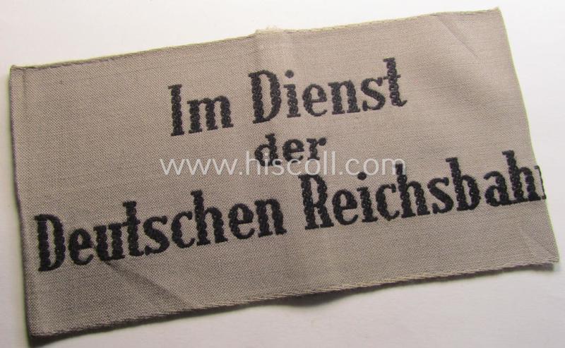 Attractive - and scarcely seen! - example of a DRB- (ie. 'Deutsche Reichsbahn'-) related armband entitled: 'Im Dienst der Deutschen Reichsbahn' being of the 'entirely-woven'-type in a technique similar to the 'BeVo'-weave pattern