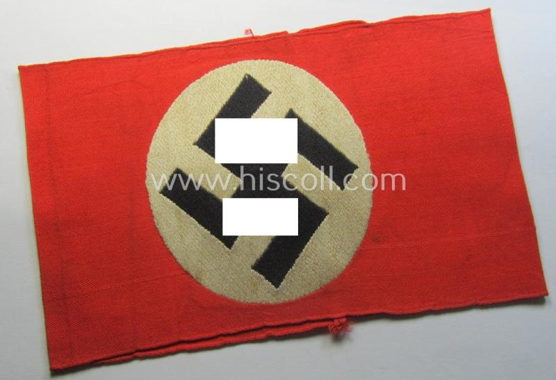 Superb - and just moderately used! - so-called: N.S.D.A.P.-related party-armband (ie. 'Armbinde') being of the 'entirely woven'-pattern showing an interwoven ie. 'machine-embroidered' swastika (ie. roundel) and period 'RzM'-etiket