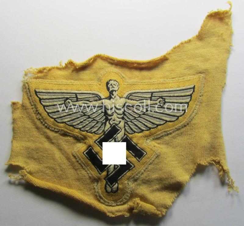 Very unusual, bright-yellow-coloured: N.S.F.K.- (or: 'National Socialistisches Flieger Korps') sports-shirt breast-eagle being a nicely 'BeVo'-woven- (and carefully 'cut-out'!) example that comes still mounted onto its piece of a period shirt