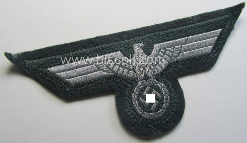 WH (Heeres) breast-eagle as executed in 'BeVo'-type-, so-called: 'flat-wire'-weave-pattern and pre-mounted on darker-green-coloured wool as was specifically intended for usage by soldiers (ie. NCOs) on their dress-tunics (ie. 'Waffenröcke')