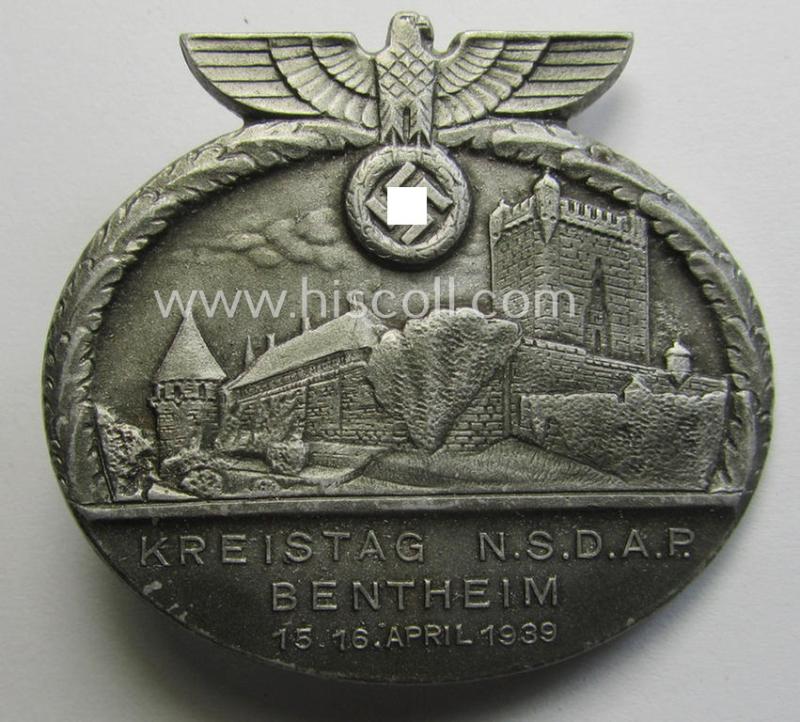 Commemorative, 'N.S.D.A.P.'-related 'tinnie' being a maker- (ie. 'Paulmann & Crone'-) marked example depicting an N.S.D.A.P.-party-eagle and towns'-view coupled with the text: 'Kreistag N.S.D.A.P. - Bentheim - 15./16. April 1939'