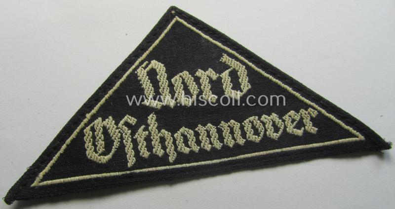 Superb - and truly rarely found! - 'HJ' ('Hitlerjugend') ie. 'BDM' ('Bund Deutscher Mädel'-) district-triangle (ie. 'Gebietsdreieck') entitled: 'Nord Osthannover' (being a clearly used- ie. worn example that has lost its 'RzM-etiket')