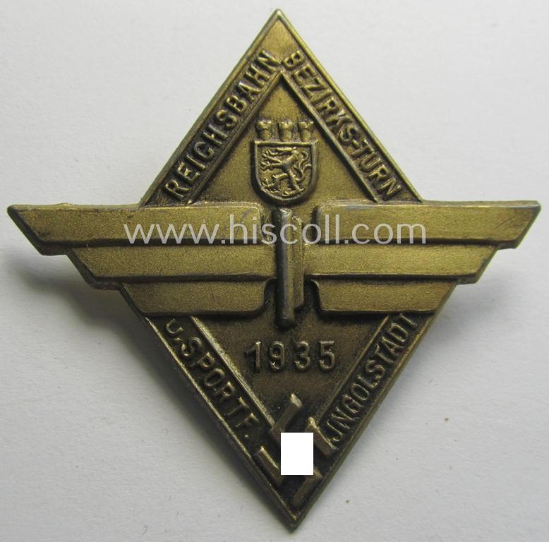 Commemorative - and unusually seen! - bright-golden-toned 'Reichsbahn'- (ie. DRB-) related 'tinnie' depicting a DRB-device, swastika and provinical-shield and surrounded by the text: 'Reichsbahn Bezirks-Turn- u. Sportf. - Ingolstadt - 1935'