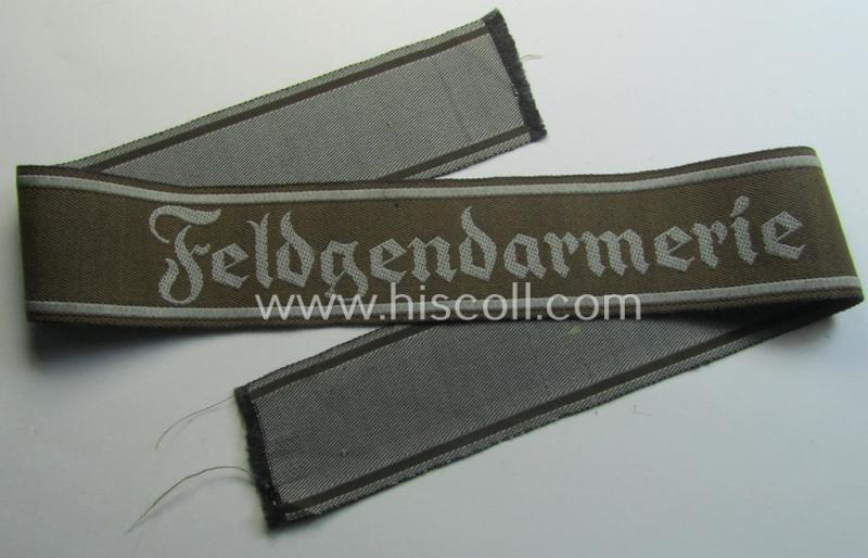 Superb - and scarcely encountered! - example of a WH (Heeres) cuff-title ie. armband (ie. 'Ärmelstreifen') entitled: 'Feldgendarmerie' (being a typical 'BeVo'-woven!) example that comes in a full length- ie. non-shortened, condition