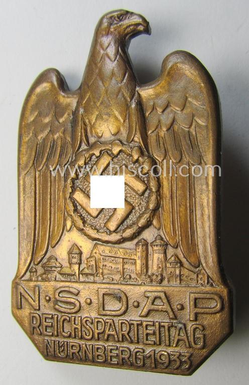 Superb, N.S.D.A.P.-related 'tinnie' (ie. 'Tagungs- o. Veranstaltungsabzeichen'-) being a clearly maker- (ie. 'C. Balmberger - Nürnberg'-) marked and/or golden-bronze-toned example showing the text: 'N.S.D.A.P. Reichsparteitag - Nürnberg 1933'