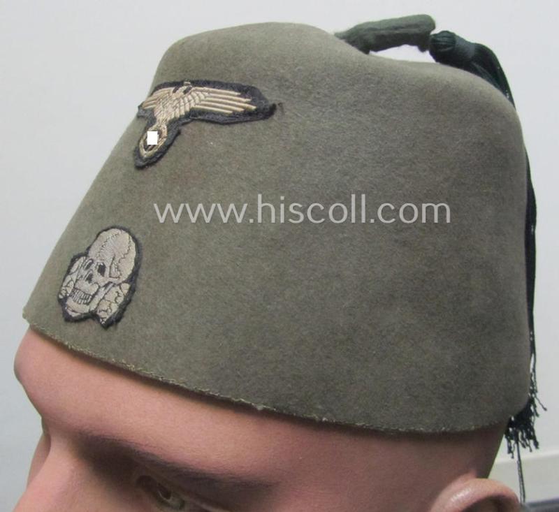 Superb - and rarely found! - field-grey-coloured and/or woolen-based: Waffen-SS 'Fez' (being a 'virtually mint- ie. unissued' example having a neat - and fully matching! - set of silver-grey-coloured 'BeVo'-insignia, originally-attached)