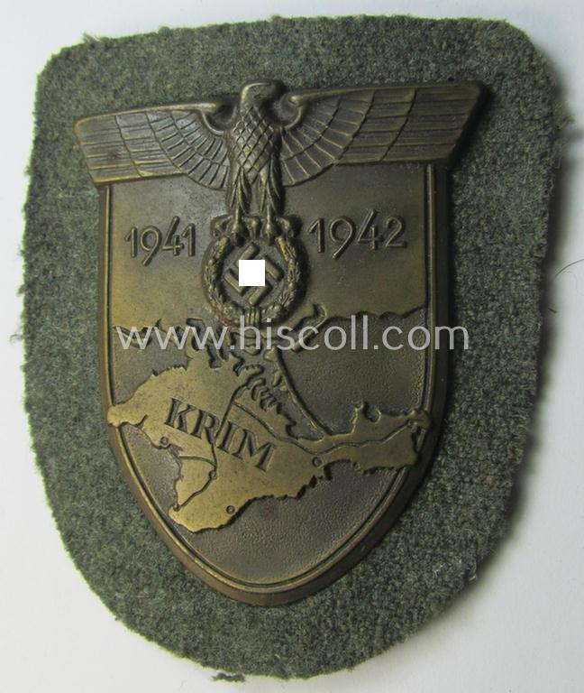 Attractive - and I deem issued but simply never used! - WH (Heeres ie. Waffen-SS) 'Krim'-campaign-shield (as was produced by a by me unidentified maker) and that comes in a wonderful and/or fully untouched, condition