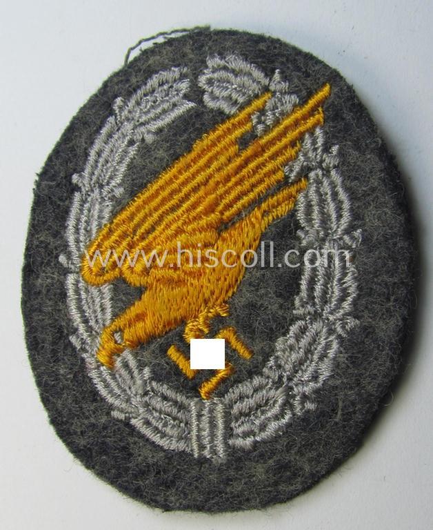 Superb, WH (Luftwaffe) 'Fallschirmschützen-Abzeichen in Stoff' (or: cloth-based paratroopers'-jump-badge) being a nicely machine-embroidered specimen that comes in a clearly issued, moderately worn and/or carefully tunic-removed-, condition