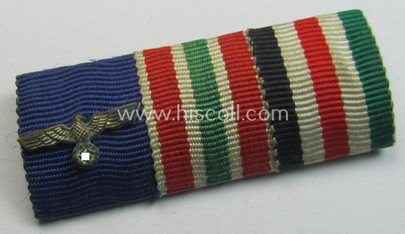 Neat, 3-pieced medal-bar (ie. 'Band- o. Feldspange') showing resp. the ribbons for a: 'WH (Heeres) D.A. der 4. Stufe', a: WH Memelland 'Anschluss'- (ie. occupation-) medal: '22 März 1939' and a: 'Deutsch-Italienische Feldzugsmedaille'