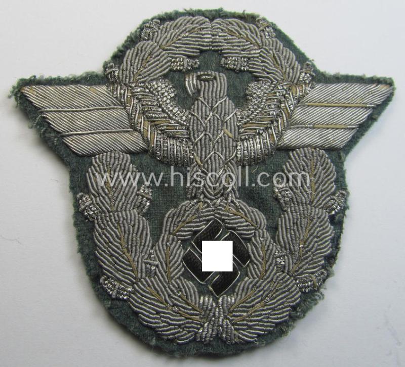 Attractive - and scarcely encountered! - neatly hand-embroidered example of an officers'-pattern so-called: 'Polizei' (ie. police) arm-eagle (as executed in silver-toned braid!) and that comes in a moderately used- and/or worn, condition