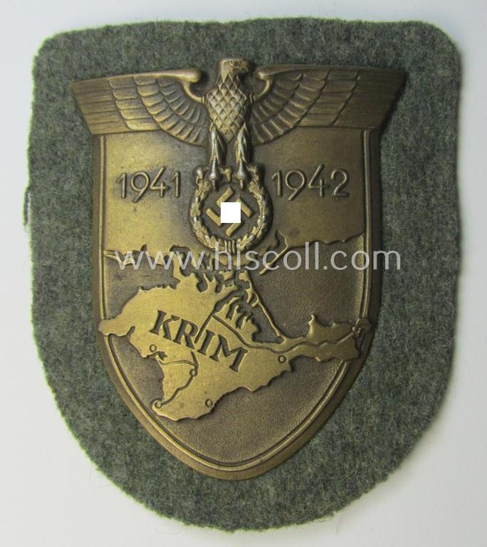 Attractive - and I deem issued but simply never used! - WH (Heeres ie. Waffen-SS) 'Krim'-campaign-shield (as was produced by a by me unidentified maker) and that comes in a wonderful and/or fully untouched, condition