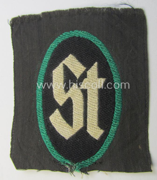 Superb - and rarely seen! - 'Sicherheits- u. Hilfsdienst' (ie. 'SHD'-) armbadge (ie. 'Ärmelabzeichen') being a black-coloured example depicting the: 'ST'-characters as was intended for a member serving as a: 'Mitglied des SHD-Stabes'