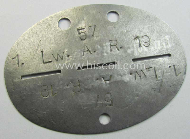 Aluminium-based, WH (Luftwaffe) ie. 'Artillerie'-related (and re-issued!) ID-disc bearing the clearly stamped unit-designation that reads: '1./LW. A.R. 19' (formerly: 'Ln.Kp. Jütland') and that comes as issued and worn