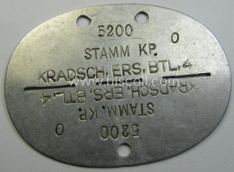 Attractive - and actually scarcely seen! - aluminium-based, WH (Heeres) ie. 'Kradschützen'-related ID-disc bearing the clearly stamped unit-designation that simply reads: 'Stamm. Kp. Kradsch.Ers.Btl. 4'