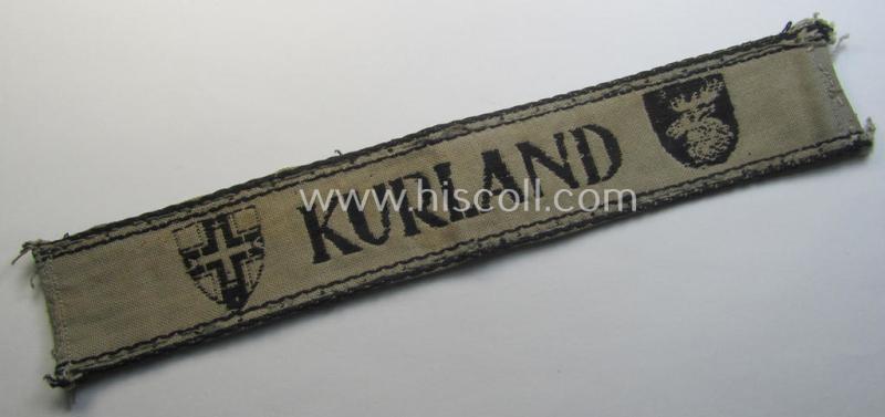 Superb, full-length example of a WH (Heeres ie. Kriegsmarine) cuff-title- ie. armband (ie. 'Ärmelstreifen') entitled: 'Kurland' that comes in an overall very nice- (albeit clearly used- ie. tunic-removed-), condition