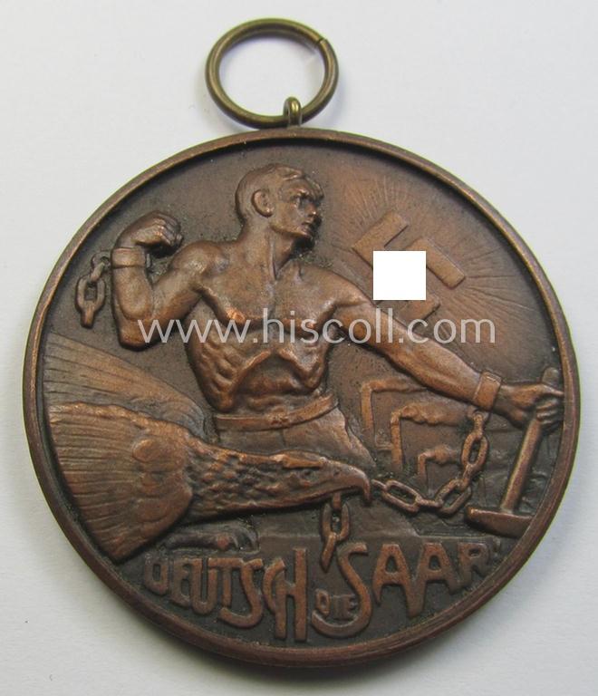 Attractive - and surely unusually found! - WHW- (ie. 'Winterhilfswerke'-) related commemorative shooting-contest medal entitled: 'Deutsch die Saar - Opferschiessen - W.H.W. - 24.3.1935'