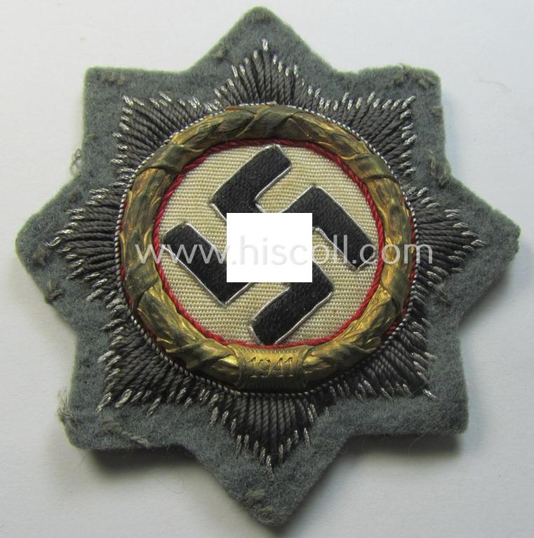Superb - clearly issued and I deem just minimally worn! - example of a cloth version of a WH (Heeres o. Waffen-SS) 'Deutsches Kreuz im Gold' (ie. DKiG or German Cross in gold) that comes in an overall very nice- (ie. fully untouched!), condition