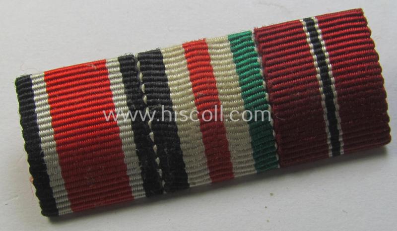 Neat, 3-pieced ribbon-bar (ie. 'Band- o. Feldspange') showing resp. the ribbons for an: 'EKII. Klasse', a: 'Deutsch-Italienische Feldzugsmedaille' and a: 'Medaille Winterschlacht im Osten 1941-42' (or: 'Ost'-medal)