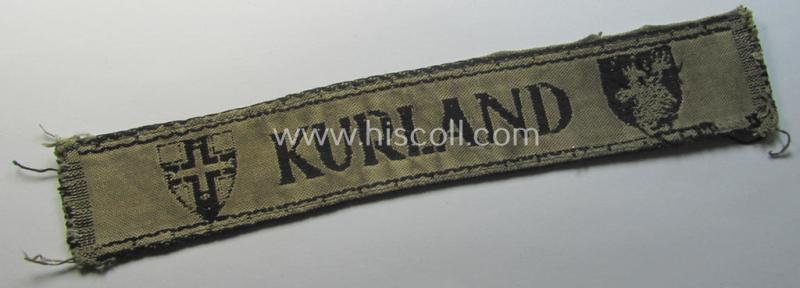 Superb, full-length example of a WH (Heeres ie. Kriegsmarine) cuff-title- ie. armband (ie. 'Ärmelstreifen') entitled: 'Kurland' that comes in an overall very nice- (albeit clearly used- ie. tunic-removed-), condition