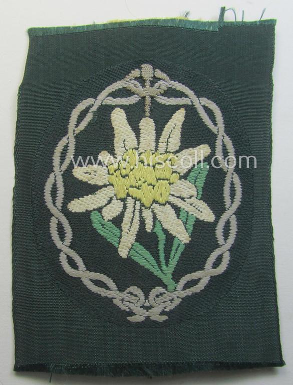 WH (Heeres) EM- (ie. NCO-) type, so-called: 'Edelweiss'-armpatch being a 'BeVo'-woven example as was executed on darker-green linnen as was specifically intended for usage by the: 'Gebirgsjäger-Truppen'