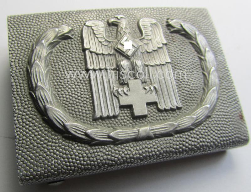 Aluminium-based, so-called: DRK (ie. 'Deutsches Rotes Kreuz'), enlisted-mens'- (ie. NCO-) type belt-buckle being a maker- (ie. 'JFS'-) marked and: 1939-dated example