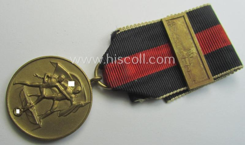 WH Czech-occupation- (ie. 'Anschluss'-) medal: '1. Oktober 1938' being a neat (albeit minimally tarnished) example that comes mounted onto its period ribbon and that shows a firmly (and period!) attached 'Prager Burg-Spange'