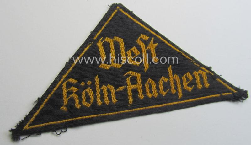 'HJ' ('Hitlerjugend') district-triangle (ie. 'Gebietsdreieck') entitled: 'West Köln-Aachen' (being an untouched example that misses its 'RzM'-etiket)