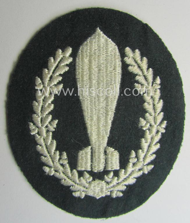 WH (Heeres) 'Nebelwerfer Richtkannonier'- (or: qualified smoke-troops canon-operator) patch as executed in the neat 'machine-embroidered'-pattern