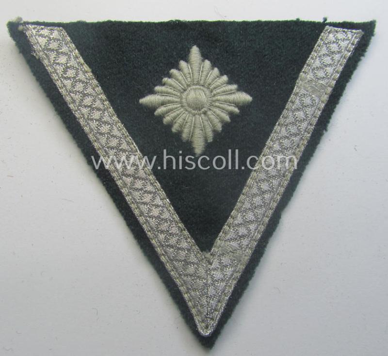 WH (Heeres) 'Armwinkel' (or: arm-chevron) as executed on typical darker-green-coloured wool as was specifically intended for usage by a soldier with the (unusually encountered!) rank of an: 'Obergefreiter mit mehr als 6 Dienstjahren'