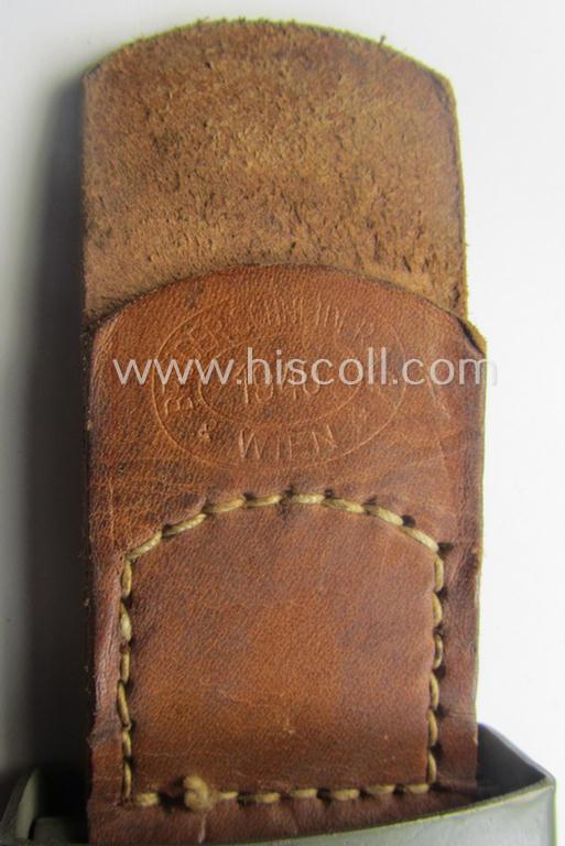 'Stonemint', WH (Heeres) 'standard-issue'-pattern, field-grey-toned- and/or steel-based belt-buckle being a maker- (ie. 'Brüder Schneider A.G.'-) marked- and/or: '1940'-dated example that came mounted onto its leather-based tab