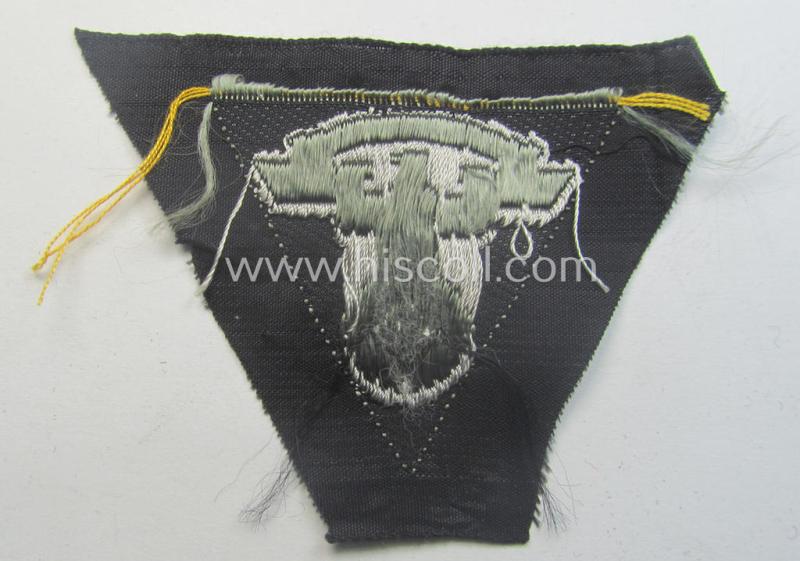 N.S.K.K. (ie. 'National Socialistisches Kraftfahr Korps') side-cap-eagle (ie. 'Adler für N.S.K.K.-Schiffchen o. Lagermütze') being a 'BeVo'-woven-example onto a bright-grey-coloured background