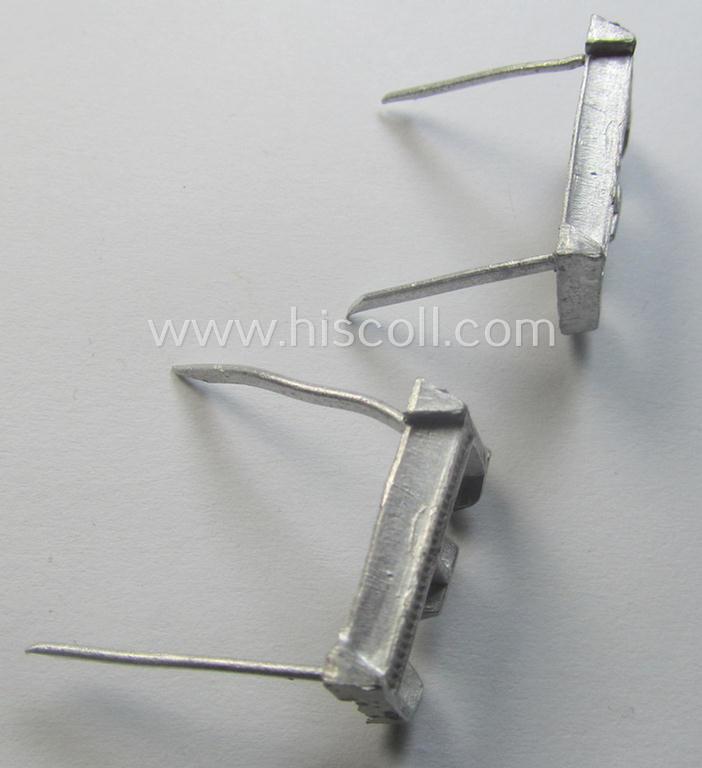 Pair of NCO-type- (thus silver-coloured), Waffen-SS- (ie. SS-VT-) related shoulderstrap-cyphers (ie. 'Schulterstückauflagen o. Ziffern') depicting a capital 'E'-character for usage by an NCO serving within the: 'Ergänzungsstellen der Waffen-SS'