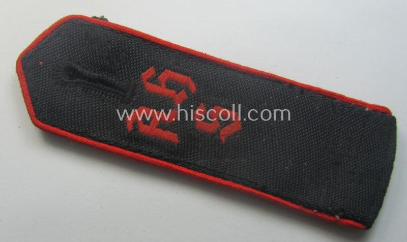 Superb - and rarely encountered! - red-piped, so-called: 'Allgemeine' HJ ('Hitlerjugend') shoulderstrap as was intended for a student who served within one of the: 'Adolf Hitler Schulen' (still having the remains of its 'RzM'-etiket attached)