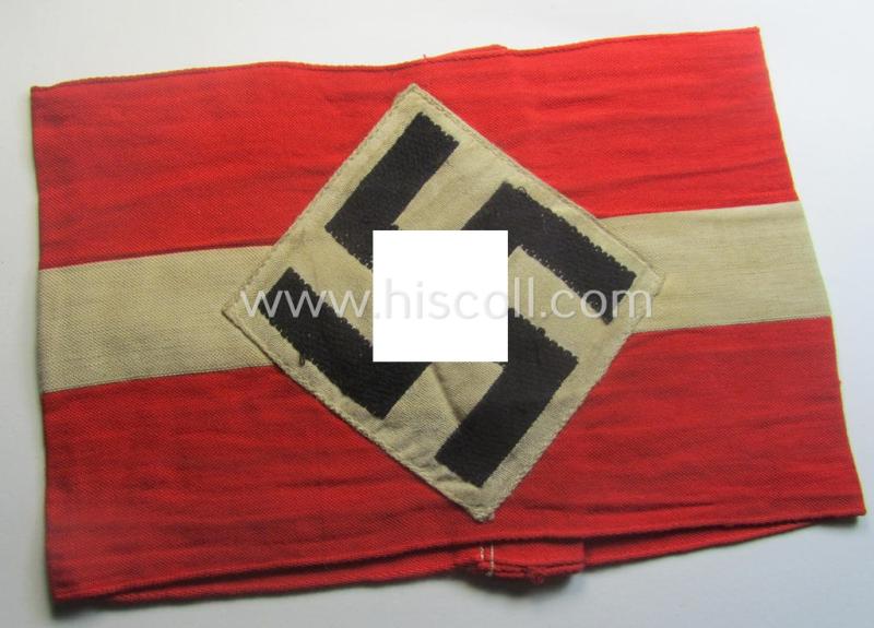 'Standard-issued'-pattern (ie. entirely woven) pattern, bright-red-coloured HJ- (ie. 'Hitlerjugend'-) related armband (ie. 'Armbinde') being a moderately worn- ie. used example that misses its 'RzM'-etiket