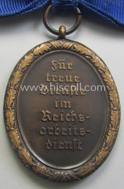 Scarcely encountered example of a: 'Reichsarbeitsdienst der weiblichen Jugend' (or: RADwJ) so-called: 'Dienstauszeichnung der 4. Stf. in Bronze' that comes mounted onto its period ('bow-tie'-shaped) ribbon (ie. 'Bandabschnitt')