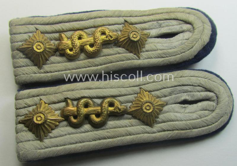Attractive - and fully matching! - pair of 'cyphered', WH (Heeres) officers'-pattern shoulderboards as piped in the darker-blue-toned branchcolour as was specifically intended for a: 'Hauptmann u. Arzt einer Sanitäts-Abtlgs.'