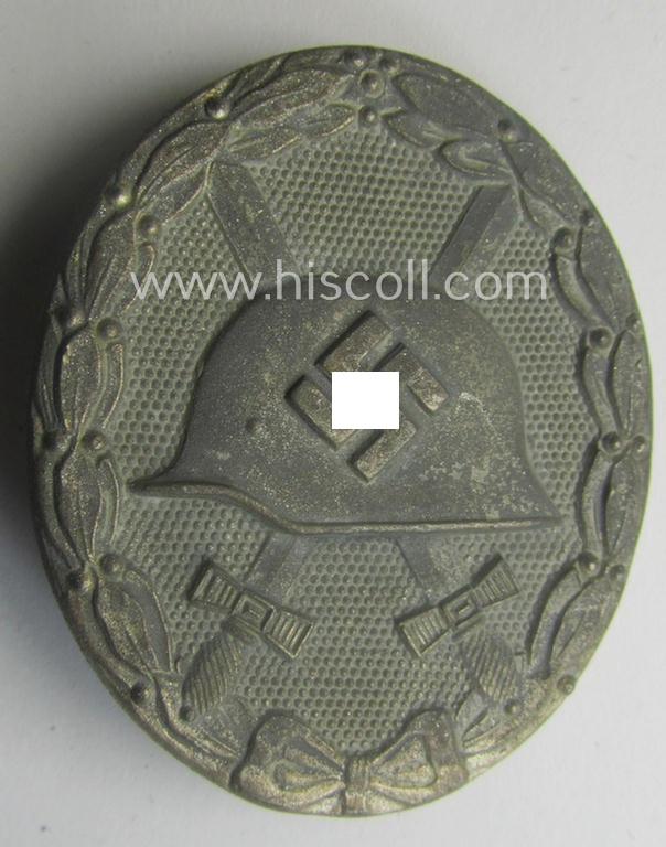 Moderately used- and/or worn 'Verwundeten-Abzeichen in Silber' being a typical maker- (ie. '65'-) marked- and/or: 'Feinzink'-based example by the maker: 'Klein & Quenzer'