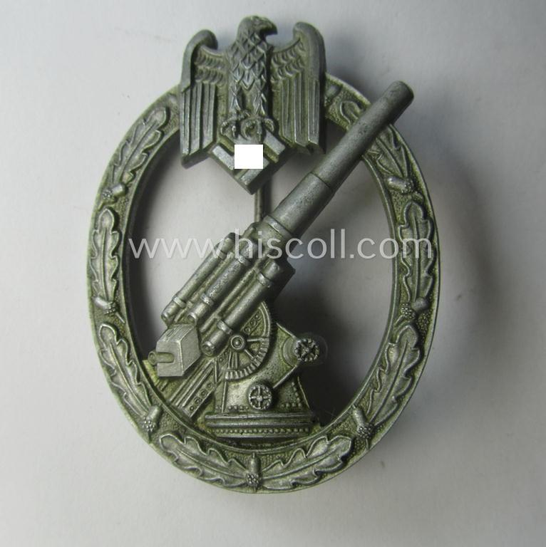 'Heeres-Flakkampf-Abzeichen' being a non-maker-marked- and/or zinc- (ie. 'Feinzink'-) based specimen of the so-called: 'pillow-crimped'-pattern (as was produced by a to date still unidentified maker)