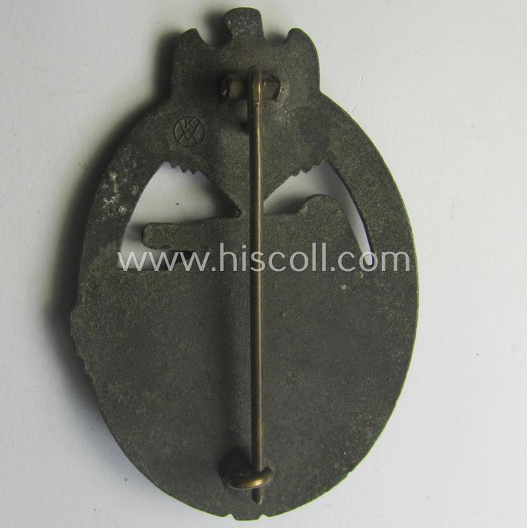 'Panzerkampfabzeichen in Bronze' being a clearly maker- (ie. 'KWM'-) marked (and/or: typical zinc- ie. 'Feinzink'-based-) example as was procuced by the: 'Karl Würster'-company