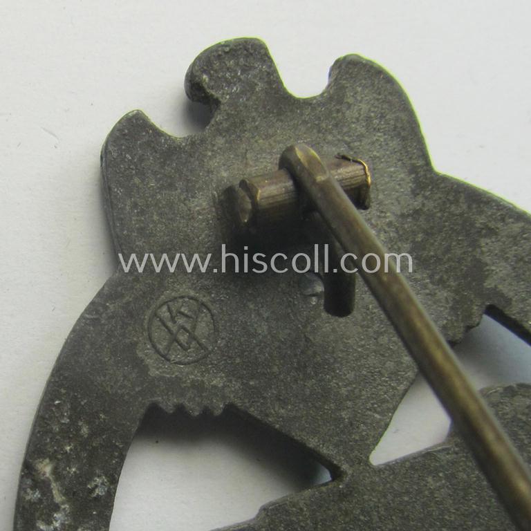 'Panzerkampfabzeichen in Bronze' being a clearly maker- (ie. 'KWM'-) marked (and/or: typical zinc- ie. 'Feinzink'-based-) example as was procuced by the: 'Karl Würster'-company