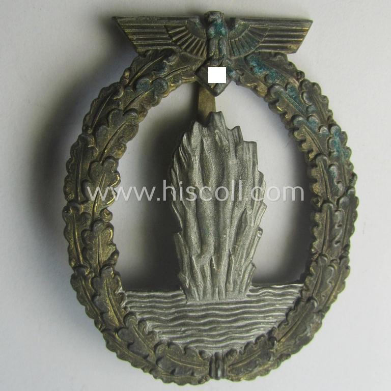 WH (Kriegsmarine) 'Kriegsabzeichen für Minensuch-, U-Boot-Jagd und Sicherungs-Verbände' being a detailed and clearly maker- (ie. 'R.K.') marked, 'Feinzink'-based example as was produced by the 'Rudolf Karneth'-company