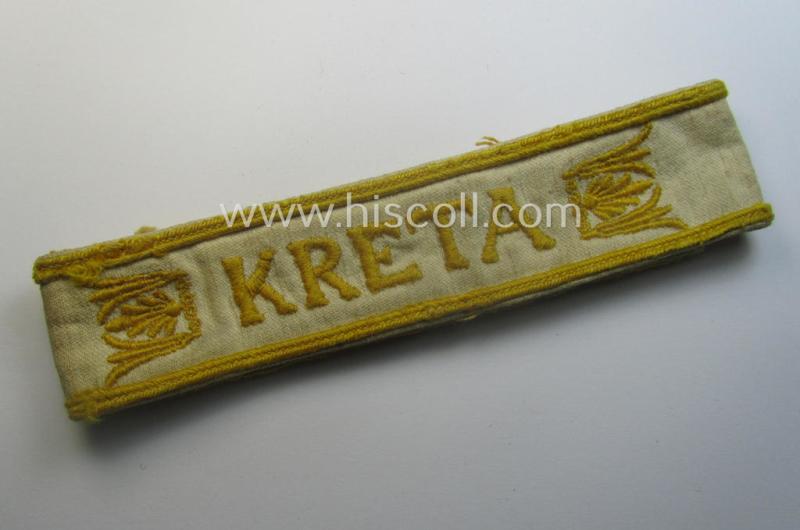 Truly worn WH cuff-title (ie. 'Ärmelstreifen') entitled: 'Kreta' (being an example that bears a printed 'RbN.'-numeral and that comes in an issued-, clearly worn- and/or most certainly once tunic-attached, condition)