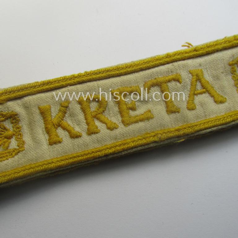 Truly worn WH cuff-title (ie. 'Ärmelstreifen') entitled: 'Kreta' (being an example that bears a printed 'RbN.'-numeral and that comes in an issued-, clearly worn- and/or most certainly once tunic-attached, condition)