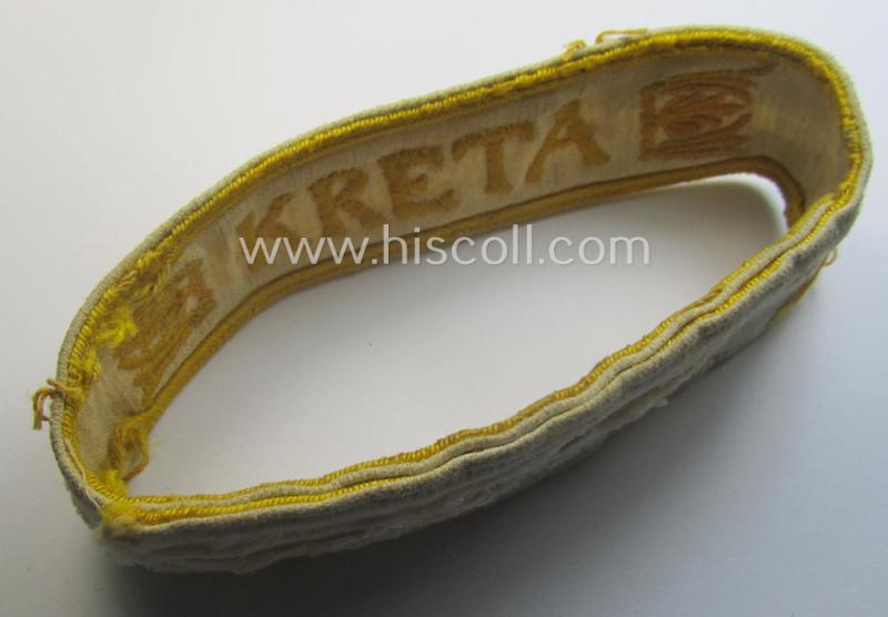 Truly worn WH cuff-title (ie. 'Ärmelstreifen') entitled: 'Kreta' (being an example that bears a printed 'RbN.'-numeral and that comes in an issued-, clearly worn- and/or most certainly once tunic-attached, condition)
